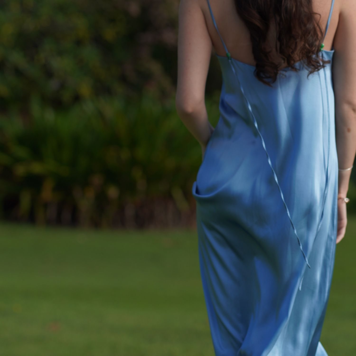 A blue Como silk slip, seen from the back