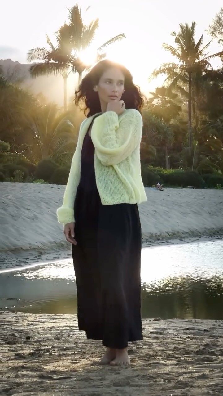 Peru: the Inessa alpaca cardigan in misty yellow, by the water at dusk